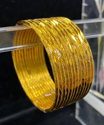 Set of 12 coloured metal bangles. Perfect to style with any outfit and to wear on any occassion.