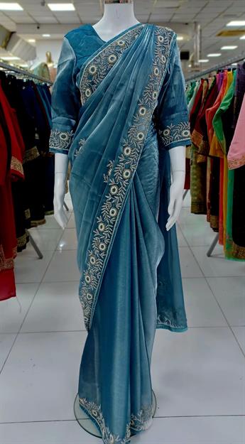 Organza shimer saree with stone,and thread embroidary havy work.It comes with readymade long sleeve 