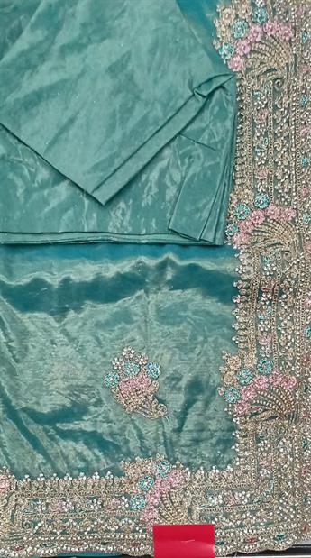 Tissue net saree with thread and stone works embroidary border.Its comes with readymade 3quater slee