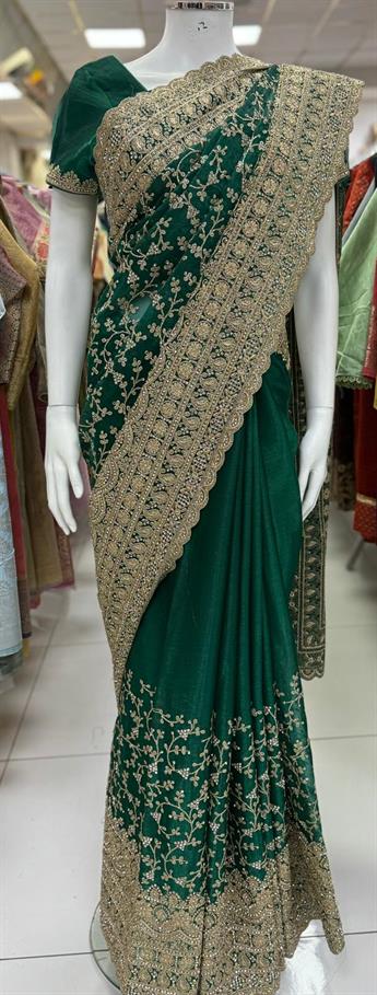 Jmmi cho saree with kasab,dori and stone works heavy embroidary border.It comes with readymade short