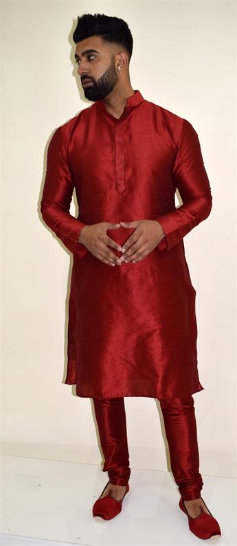 Silk art dupion kurta pajma with simple button on the neckline comes complete with pajma