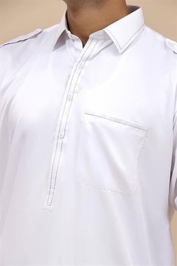 Kurta shalwar with simple button detailing around the neck line in soft and shiny fabric. Please not