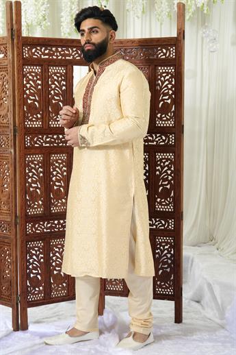 Gold brocade kurta pajma with neckline embroidery in gold/ maroon embellishment