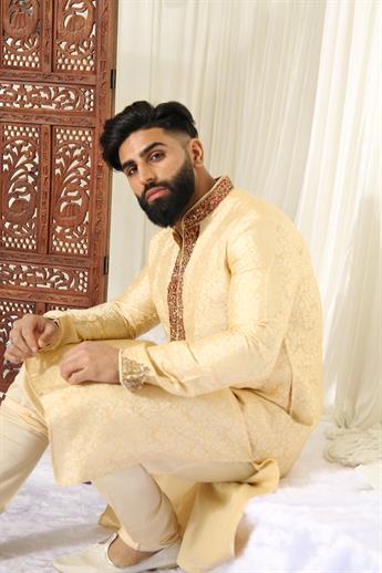 Gold brocade kurta pajma with neckline embroidery in gold/ maroon embellishment