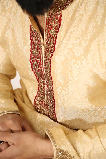 Gold brocade kurta pajma with neckline embroidery in gold/ maroon embellishment