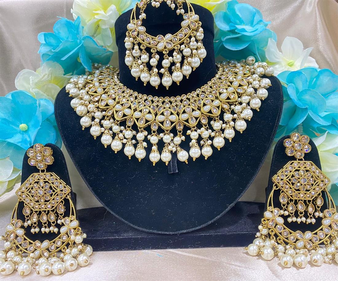 Gold & White Beautiful Necklace Set with Luxurious Earings and Tikka.