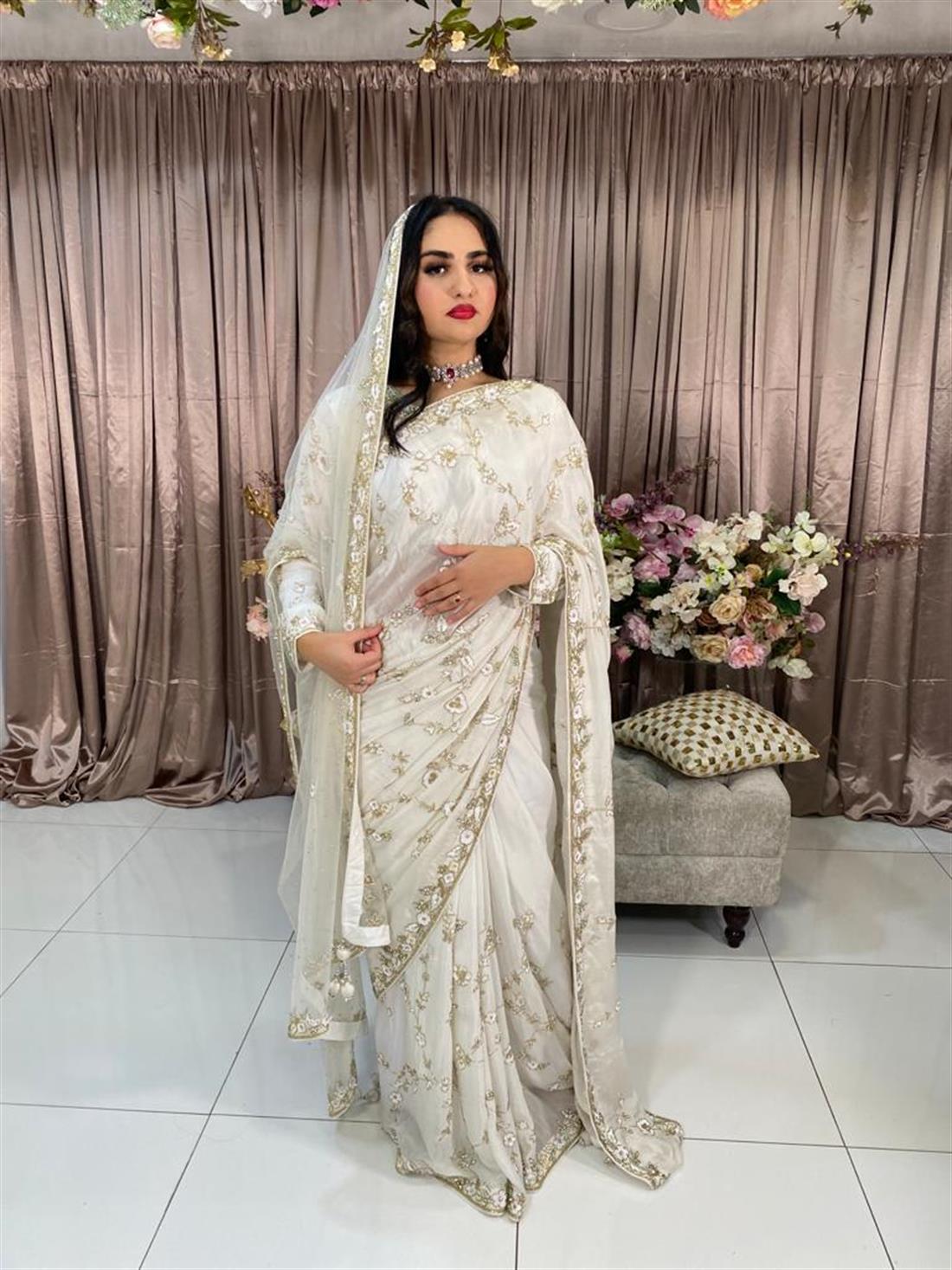Off White Crape Silk Saree.