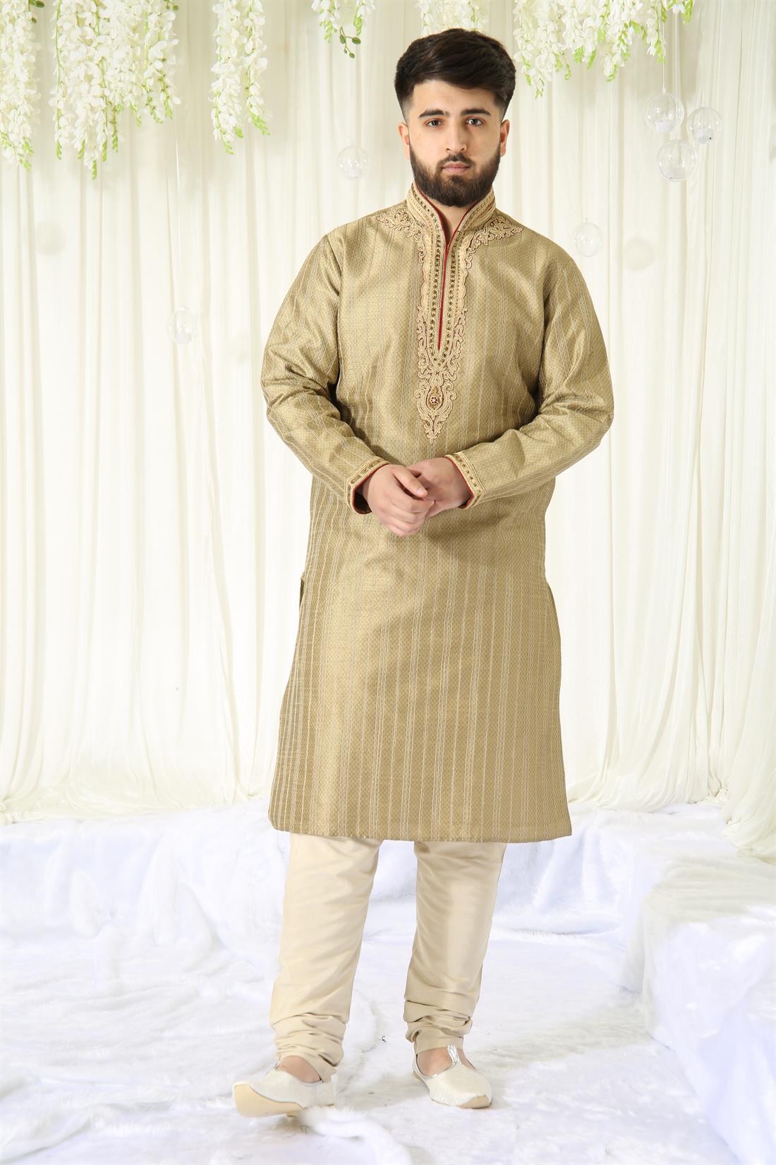 Gold Kurta with Embroidery and Touch of Maroon.