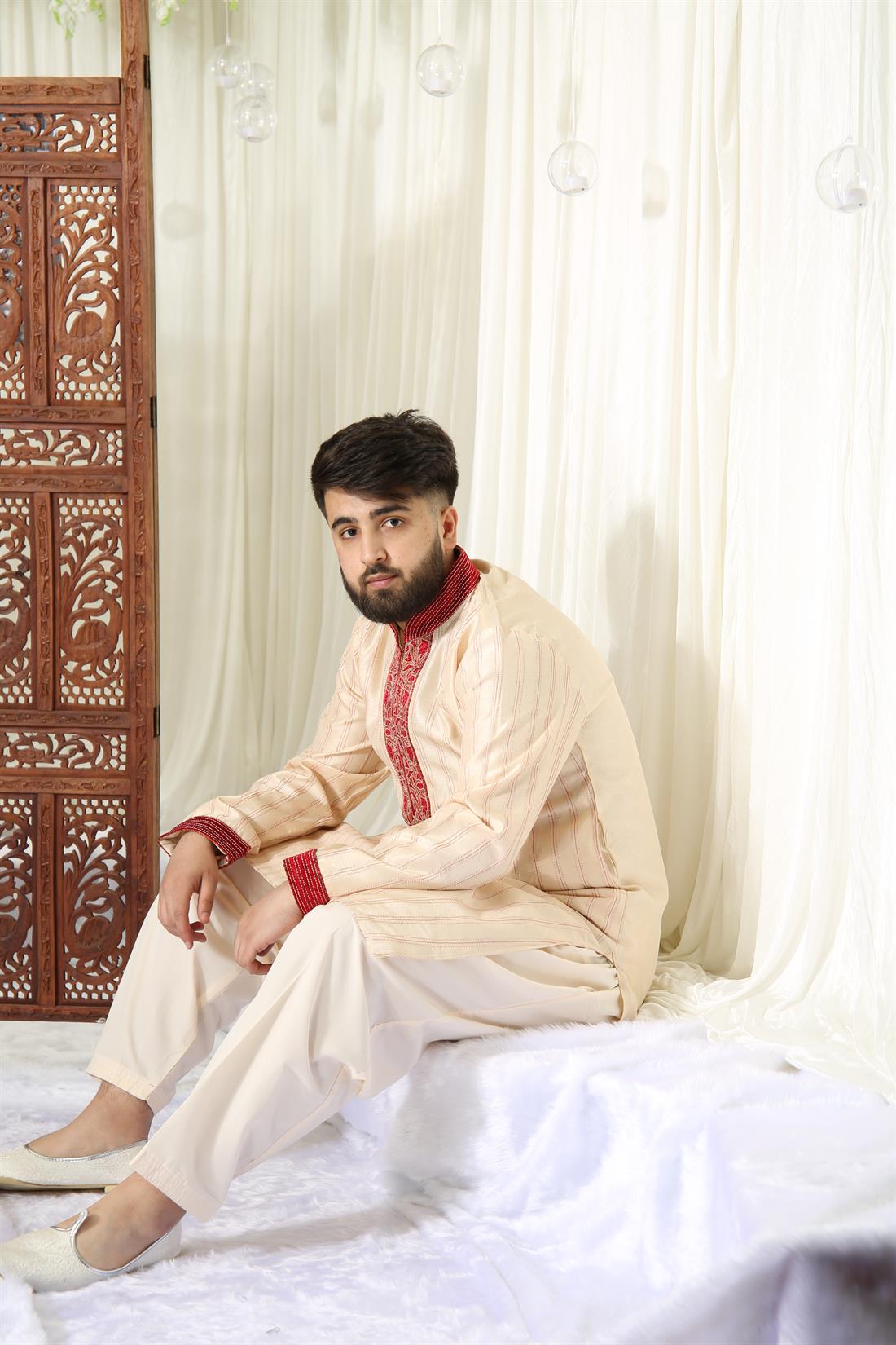 Gold Kurta Shalwar with Red Embroidery.
