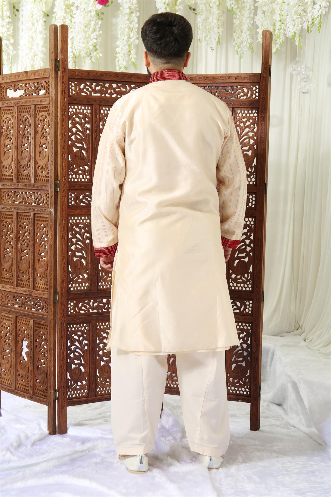 Gold Kurta Shalwar with Red Embroidery.