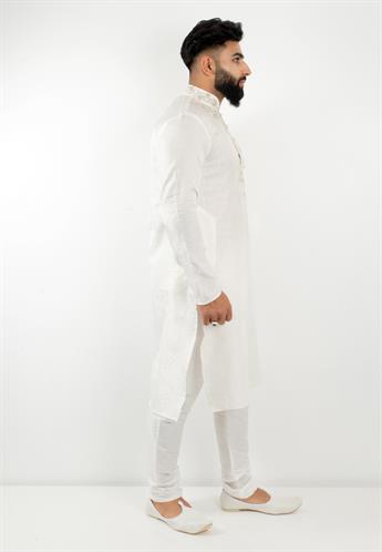 White Kurta pajma with silver emb with silver buttons a stunning piece for any occasion
