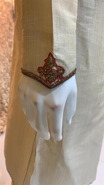 Textured  kurta pajma With gold hand emb with touch of machine, on the neck line and collar This is