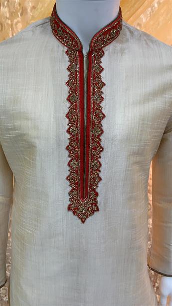 Textured  kurta pajma With gold hand emb with touch of machine, on the neck line and collar This is