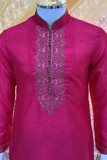 Fuchsia kurta with gold pajma. Neckline Embroidery done in gold and pink with fine piping detailing