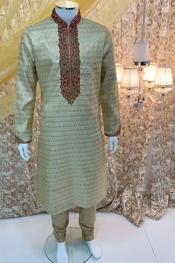 Gold brocade kurta pajma with neckline embroidery in gold/ red embellishment