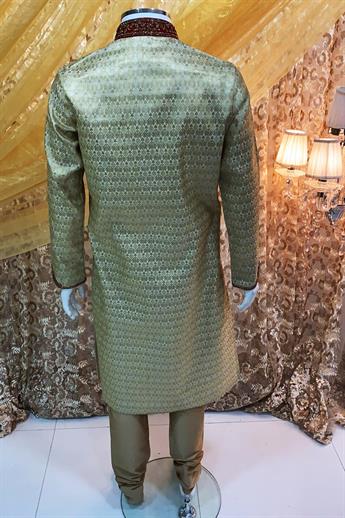 Gold brocade kurta pajma with neckline embroidery in gold/ red embellishment